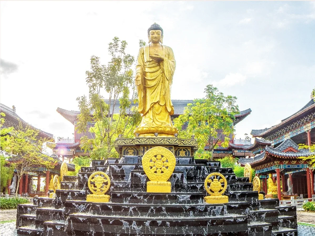 The 25-foot Amitabha Buddha and cascading water feature in the Ming Palace courtyard at Nirvana Shah Alam